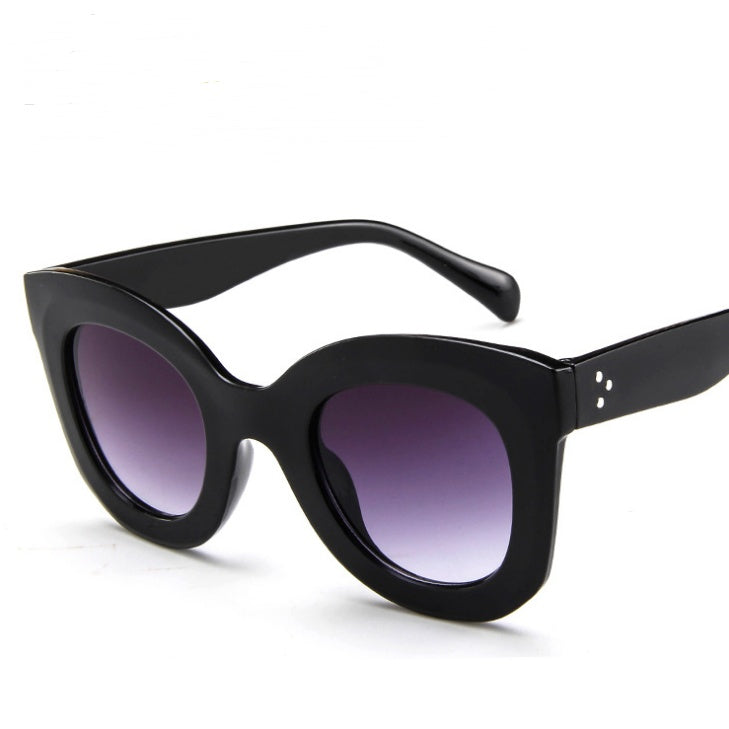 Sunglasses fashion cat eye sunglasses with black frames and gradient purple lenses.