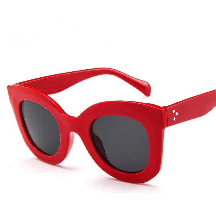 Sunglasses fashion cat eye sunglasses in vibrant red color with large lenses for a stylish look.