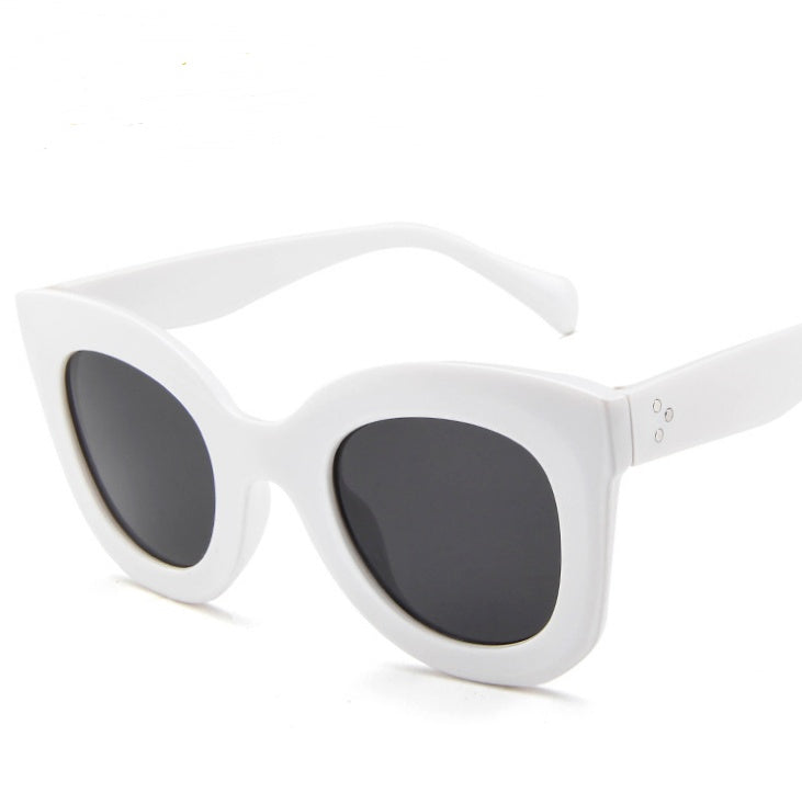 Sunglasses fashion cat eye sunglasses in stylish white frame with dark lenses.